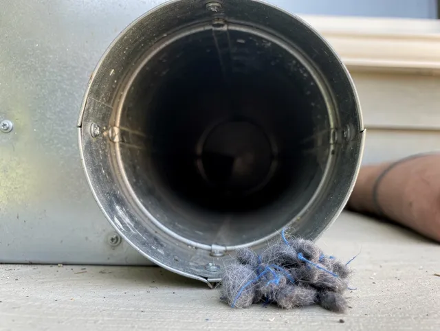 Glastonbury Dryer Vent Cleaning technician using specialized equipment to clear severe dryer vent blockage in Glastonbury